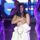 After a wardrobe malfunction, Cardi B performs in a Palms Casino robe on day four of Bonnaroo Music and Arts Festival on June 16, 2019 in Manchester, Tennessee.